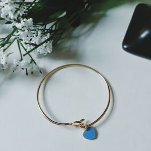 Gold tone bangle